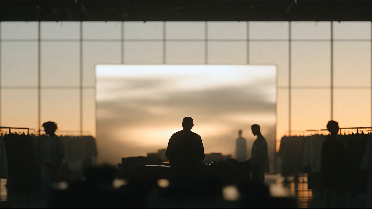 A shopper at dusk, seen from behind